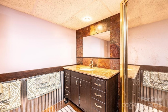 bathroom featuring vanity and a paneled ceiling