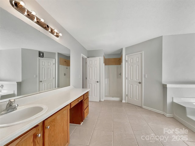 full bathroom featuring tile patterned flooring, a shower stall, vanity, and a bath