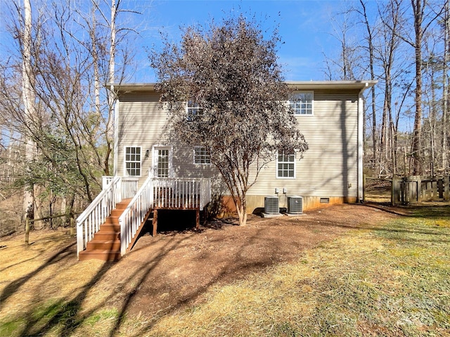 back of house featuring crawl space, stairway, cooling unit, and a wooden deck