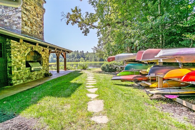 view of yard with an outdoor kitchen