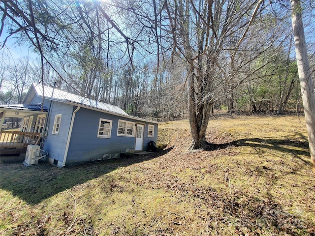 view of home's exterior with metal roof