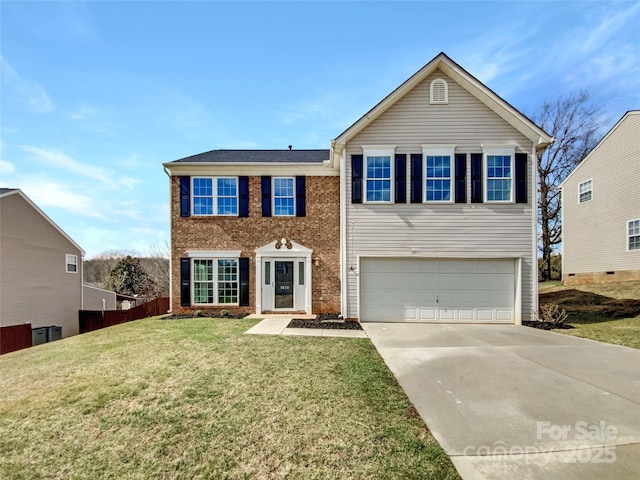 traditional-style house with brick siding, an attached garage, a front yard, fence, and driveway