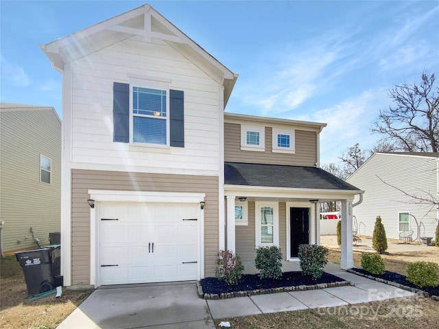 view of front of property featuring driveway, covered porch, and a garage