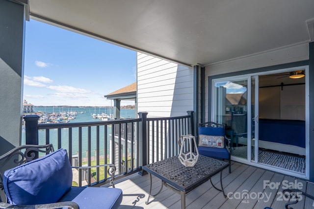 balcony featuring a water view