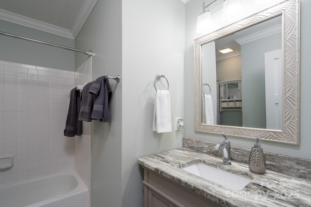 full bathroom with shower / bathing tub combination, crown molding, and vanity