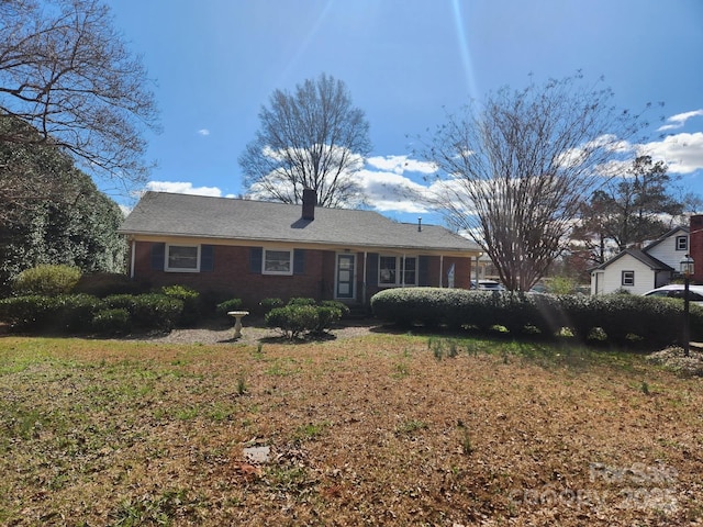 ranch-style house with a front lawn