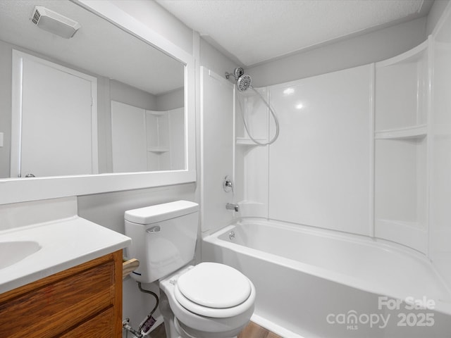 bathroom featuring toilet, bathing tub / shower combination, visible vents, and vanity