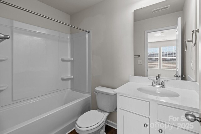 bathroom with toilet, bathing tub / shower combination, vanity, and visible vents