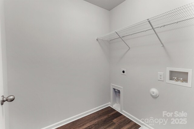 clothes washing area featuring dark wood-style floors, washer hookup, gas dryer hookup, electric dryer hookup, and laundry area