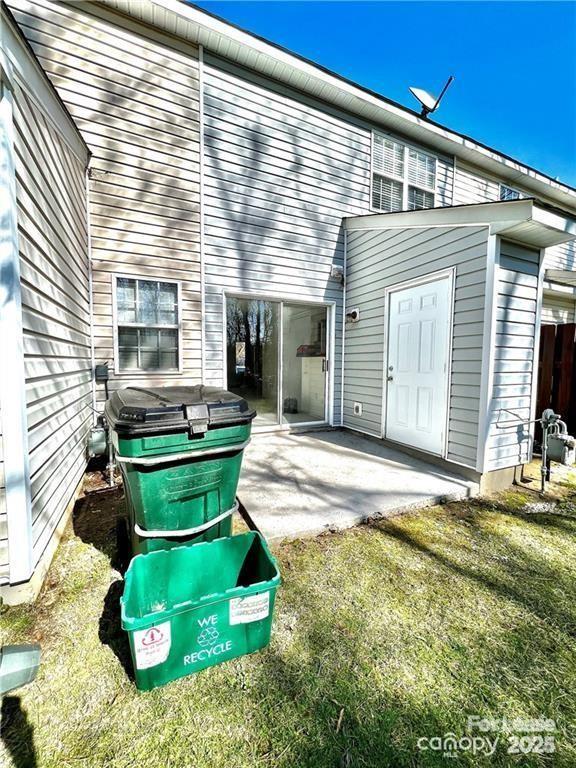 rear view of property featuring a patio