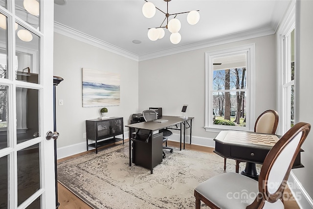 office area featuring crown molding, wood finished floors, baseboards, and a chandelier