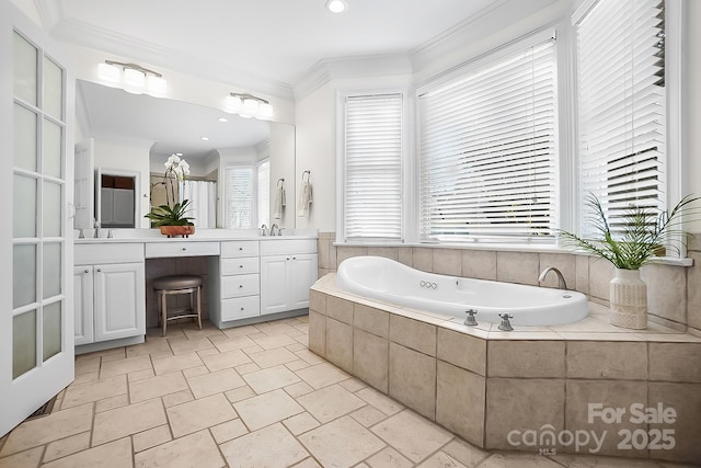 full bathroom featuring vanity, stone tile floors, recessed lighting, ornamental molding, and a bath