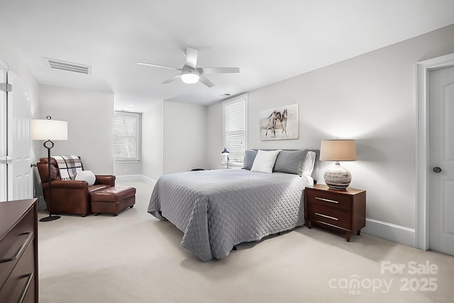 bedroom featuring visible vents, light carpet, baseboards, and a ceiling fan