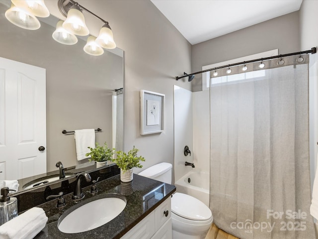 full bathroom with vanity, toilet, and shower / bath combo