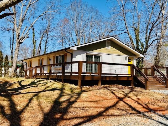 view of front of property with a wooden deck