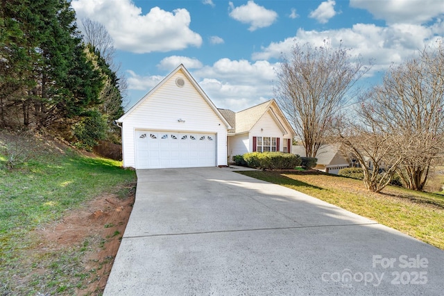 ranch-style home featuring a garage, driveway, and a front yard