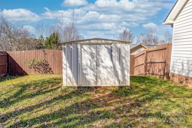 view of shed featuring a fenced backyard