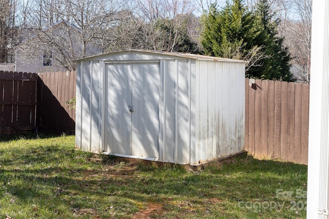 view of shed with a fenced backyard