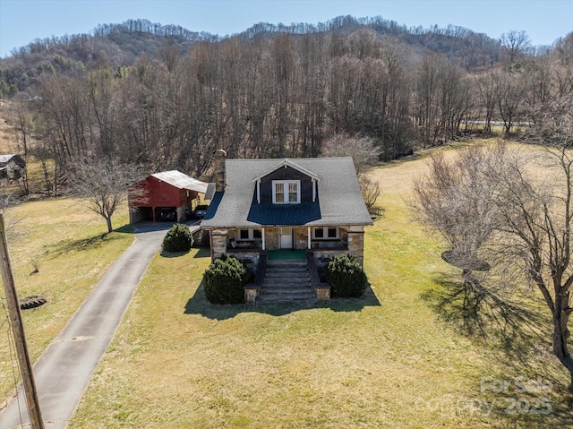 aerial view with a wooded view