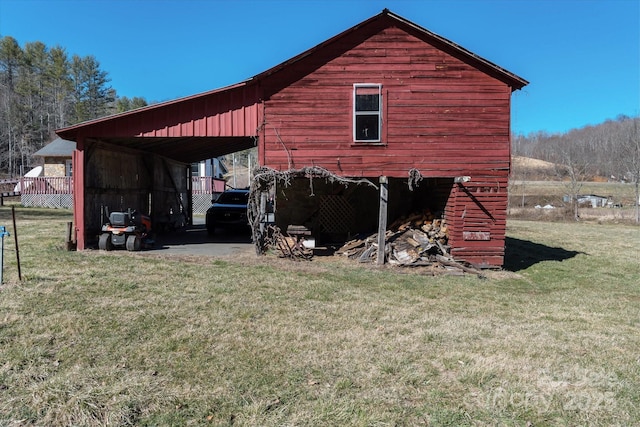 view of pole building with a lawn