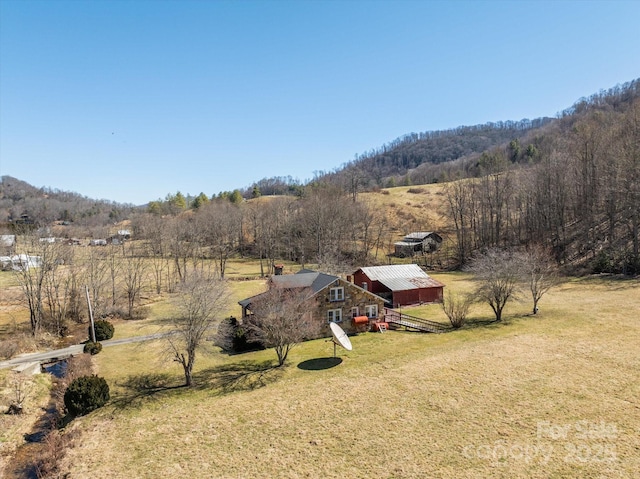 bird's eye view with a forest view and a rural view