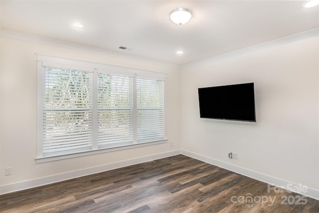 unfurnished living room with ornamental molding, recessed lighting, dark wood-style flooring, and baseboards