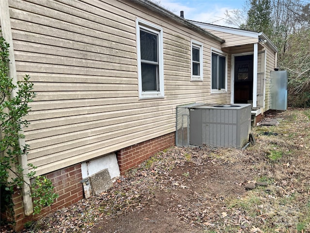 view of property exterior with central AC unit