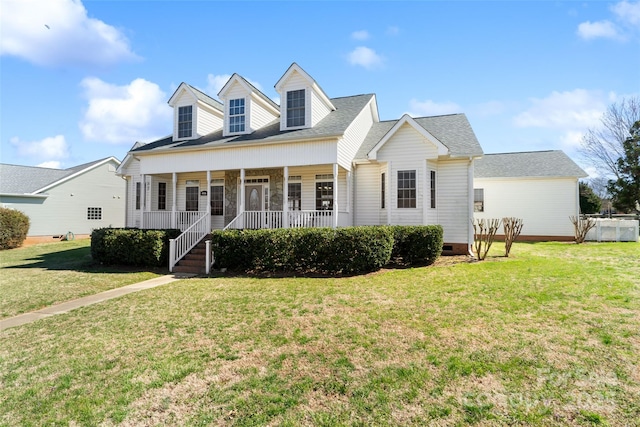 new england style home featuring crawl space, a porch, a shingled roof, and a front yard