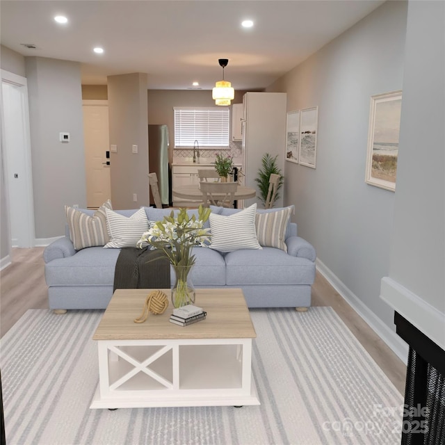 2545 Stockbridge Dr, Charlotte, NC 28210 - living room with recessed lighting, light wood finished floors, and baseboards