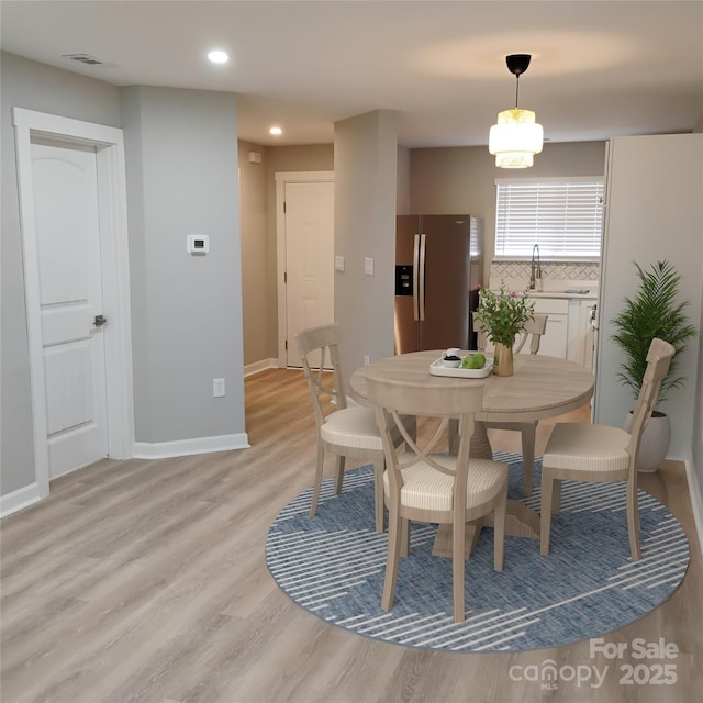 2545 Stockbridge Dr, Charlotte, NC 28210 - dining area featuring light wood-type flooring, recessed lighting, and baseboards