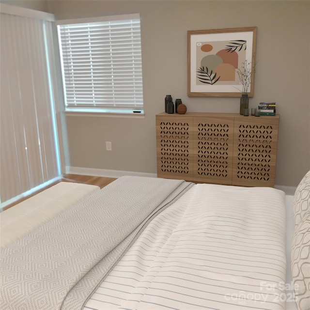 2545 Stockbridge Dr, Charlotte, NC 28210 - bedroom featuring baseboards and wood finished floors