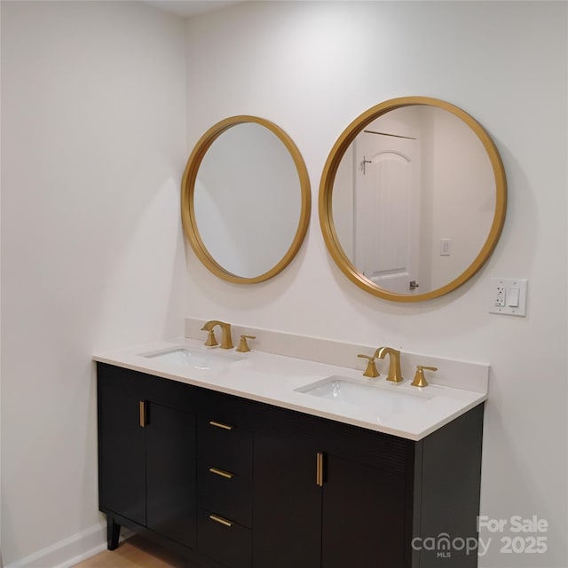 2545 Stockbridge Dr, Charlotte, NC 28210 - bathroom with double vanity and baseboards