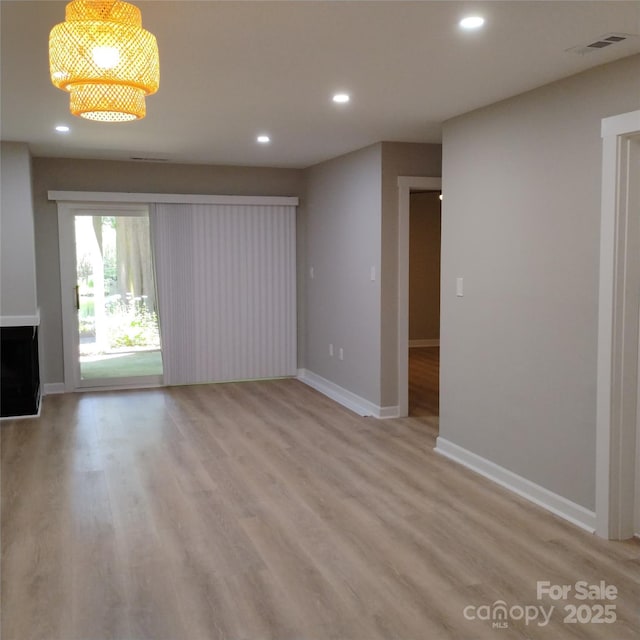 2545 Stockbridge Dr, Charlotte, NC 28210 - unfurnished living room with recessed lighting, baseboards, and light wood finished floors