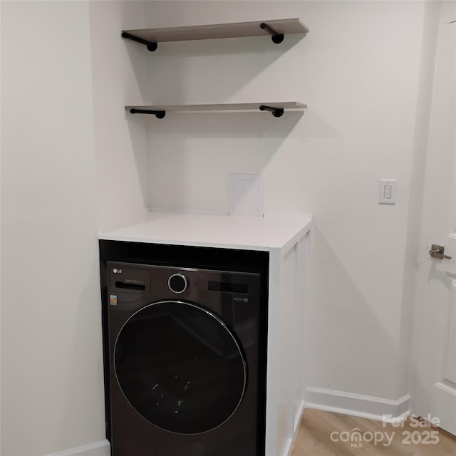2545 Stockbridge Dr, Charlotte, NC 28210 - laundry area with washer / clothes dryer and baseboards