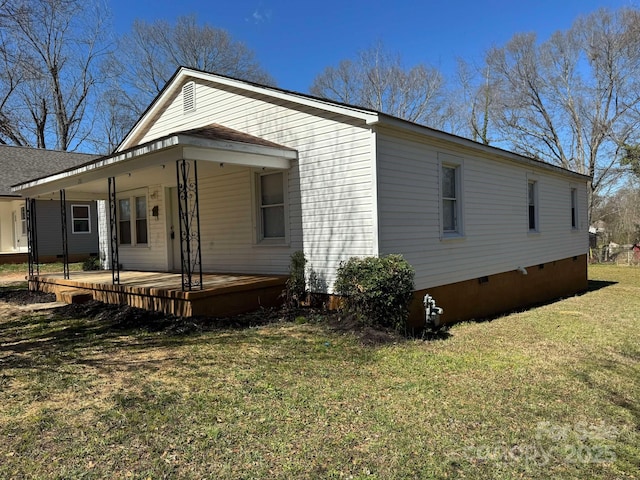 view of property exterior with crawl space and a lawn