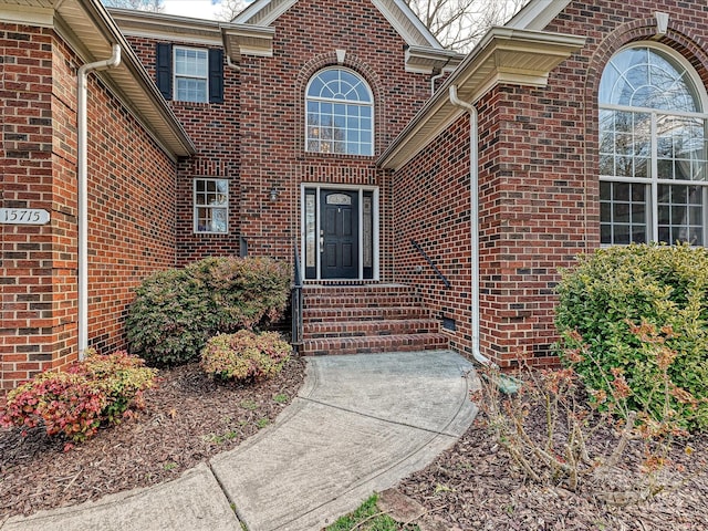 entrance to property with brick siding