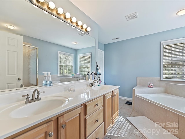 full bathroom with a garden tub, visible vents, and a sink