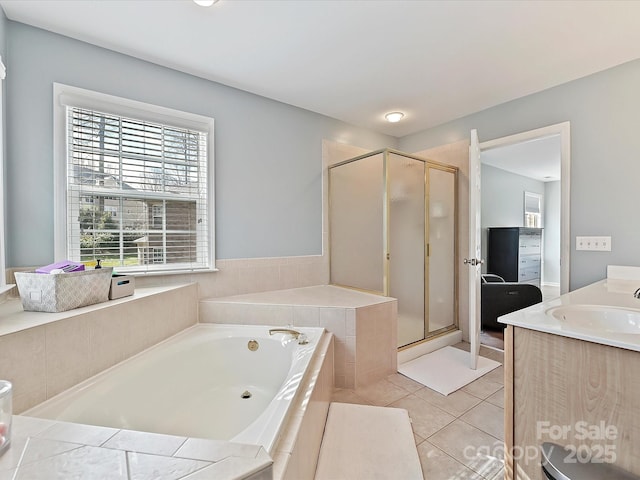 full bath featuring tile patterned flooring, a garden tub, a shower stall, and vanity