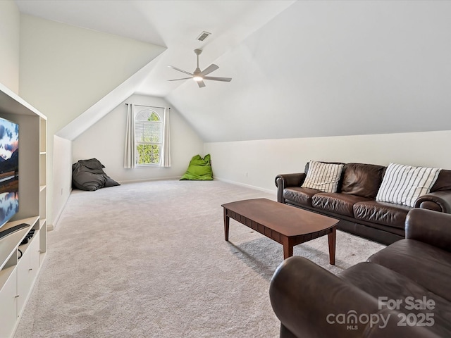 carpeted living room with vaulted ceiling, baseboards, visible vents, and a ceiling fan