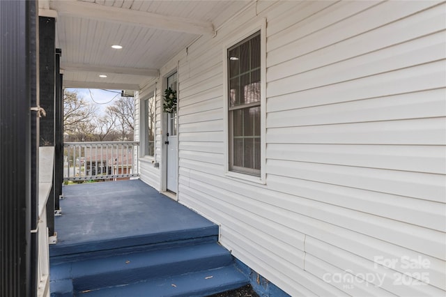 wooden deck featuring covered porch