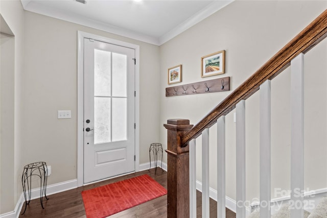 entryway with crown molding, stairway, baseboards, and dark wood-style flooring