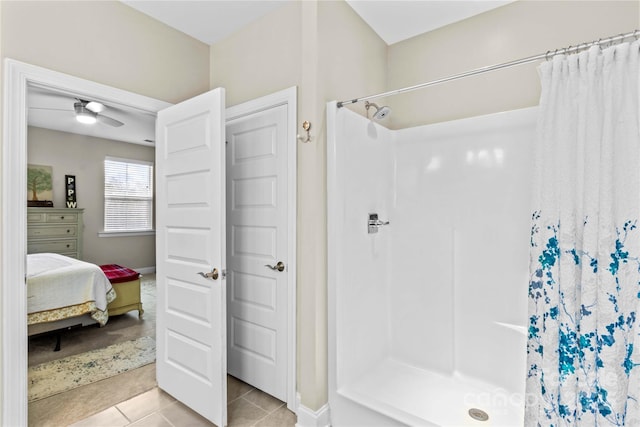 ensuite bathroom featuring tile patterned flooring, curtained shower, ensuite bathroom, and ceiling fan