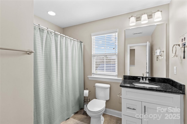 bathroom with baseboards, toilet, a shower with shower curtain, tile patterned floors, and vanity