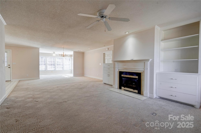 unfurnished living room featuring a fireplace with flush hearth, light colored carpet, ornamental molding, and a textured ceiling