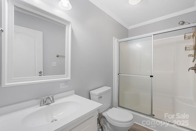 6 Clark Meadow Ln, Candler, NC 28715 - full bath featuring a textured ceiling, ornamental molding, toilet, vanity, and an enclosed shower