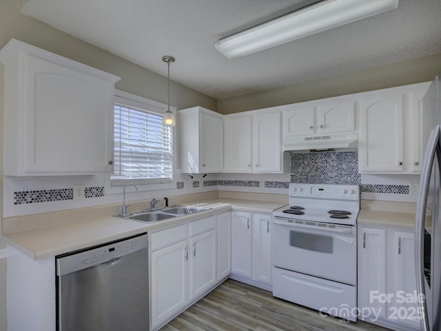 kitchen featuring under cabinet range hood, a sink, white cabinets, electric stove, and dishwasher