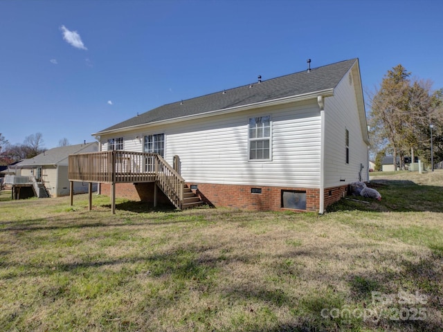 rear view of property with crawl space, a lawn, a deck, and stairs