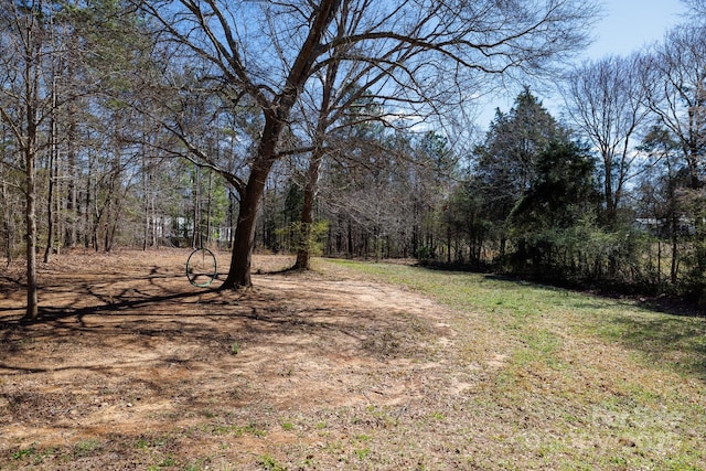 view of yard with a view of trees