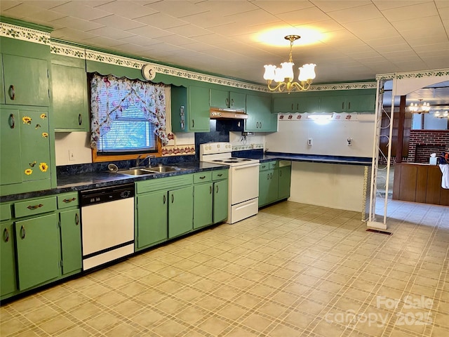 kitchen with white appliances, green cabinetry, a sink, under cabinet range hood, and a notable chandelier