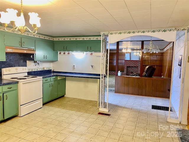 kitchen with an inviting chandelier, green cabinets, and white electric range